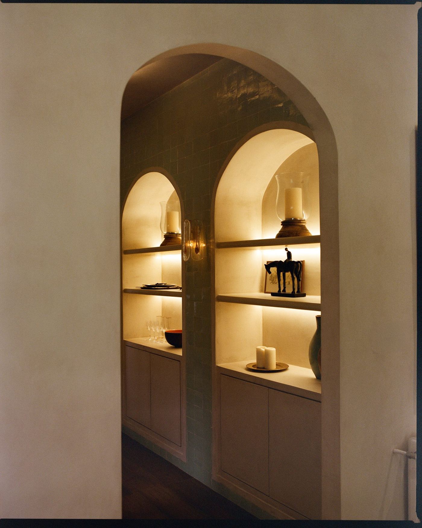 Arched display niches with ceramics and timber